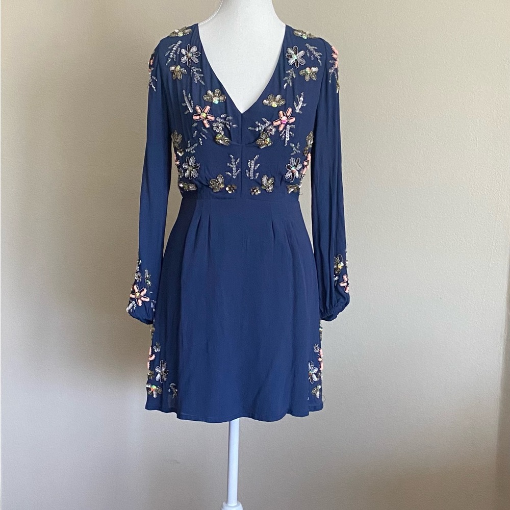 Size 8 beautiful mini dress with embellishments on the front